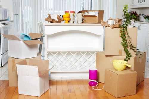 Stacked boxes and furniture inside a Strawberryhill storage unit