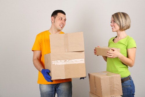 Professional office relocation team handling workspace equipment